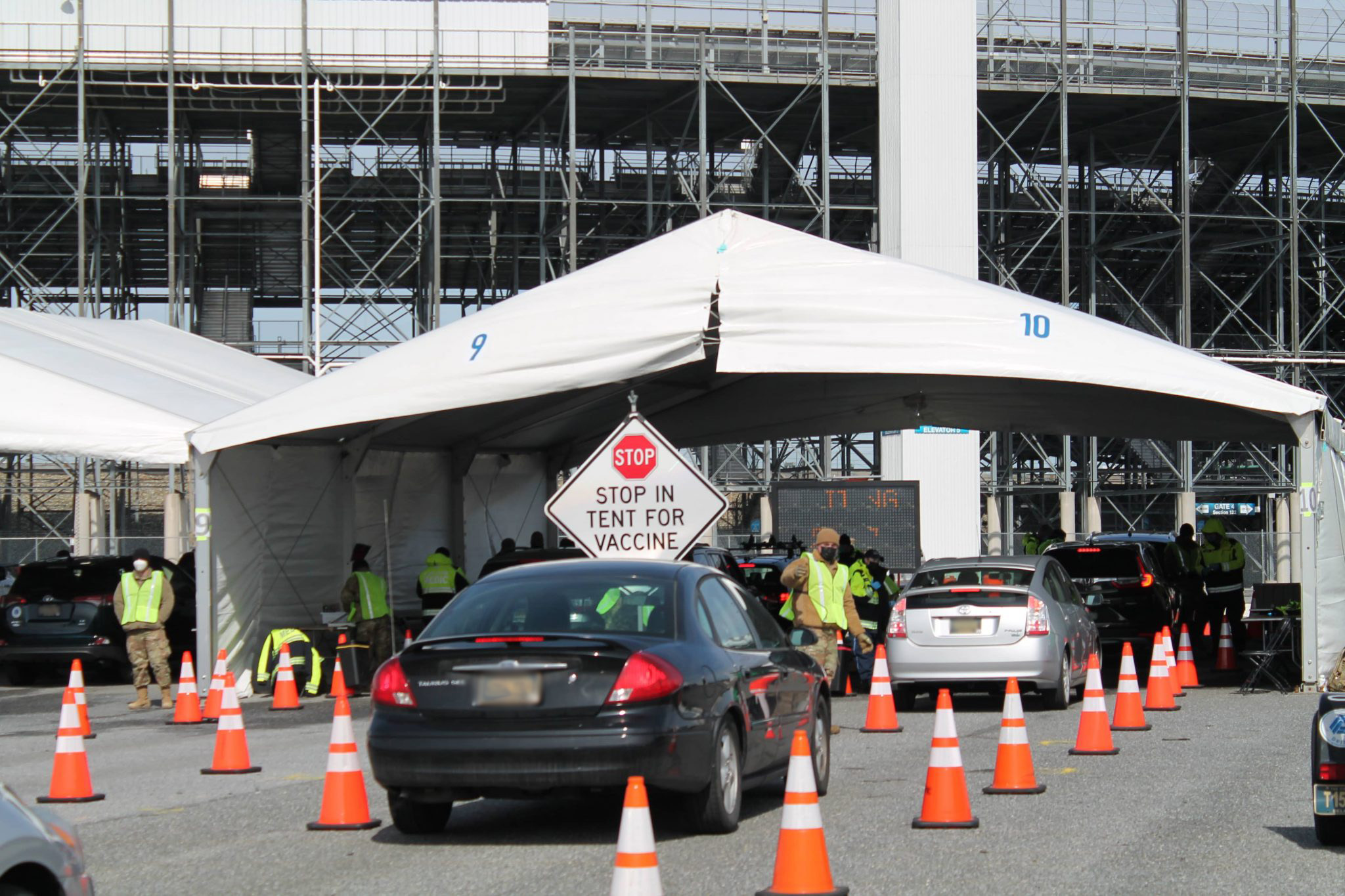 Cars lined up at a Vaccination Event at Dover Speedway